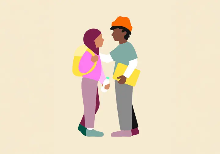 Två ungdomar som pratar med varandra.